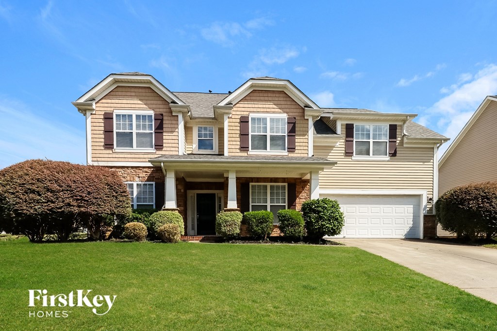 A large house with a garage is for sale.