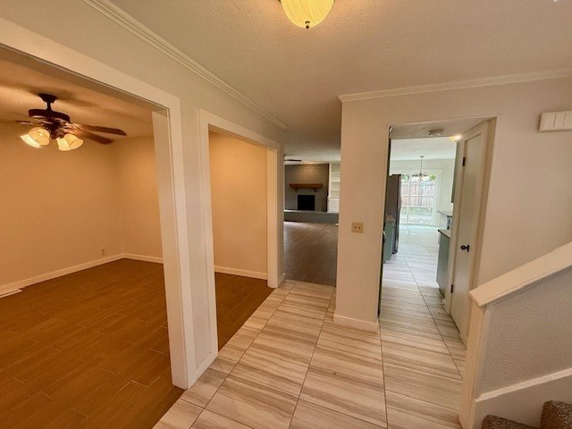 A room with a ceiling fan and a doorway leading to another room.