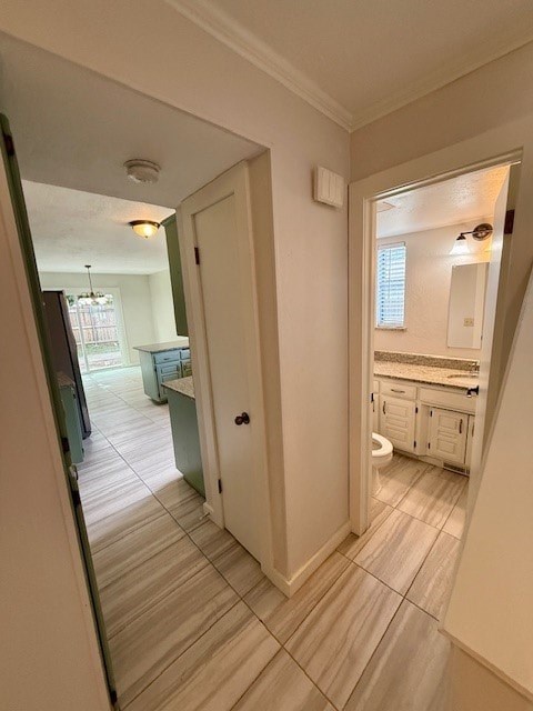 A bathroom with a toilet, sink, and mirror.