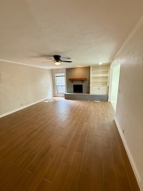 A room with a fireplace and a ceiling fan.