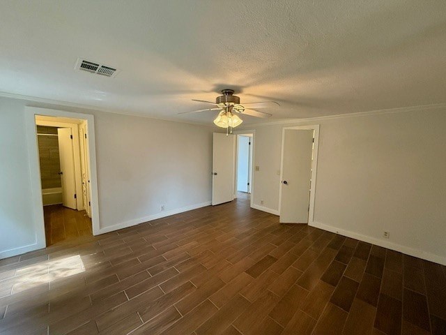 A room with wooden flooring and a ceiling fan.