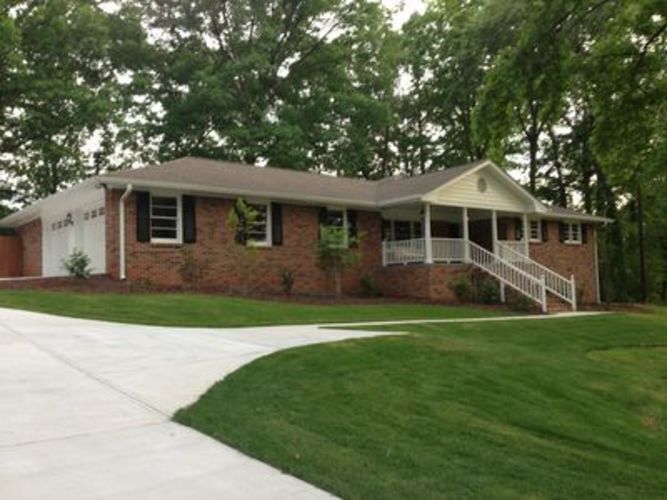 A house with a white porch and a white door.