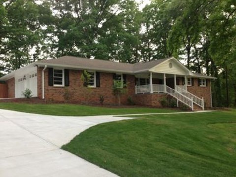 A house with a white porch and a white door.