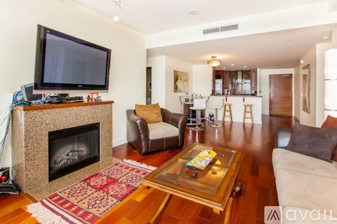 A living room with a fireplace and a television on top of it.