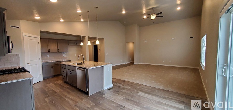 A kitchen with a countertop and a sink is available for rent.