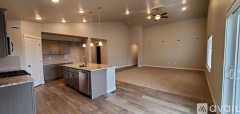 A kitchen with a countertop and a sink is available for rent.