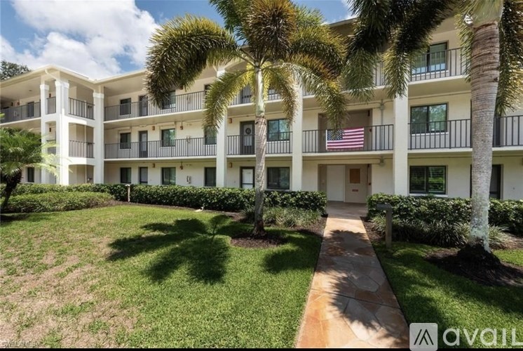 A building with a balcony and a flag on it.