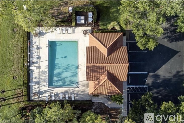 A house with a pool in the backyard.