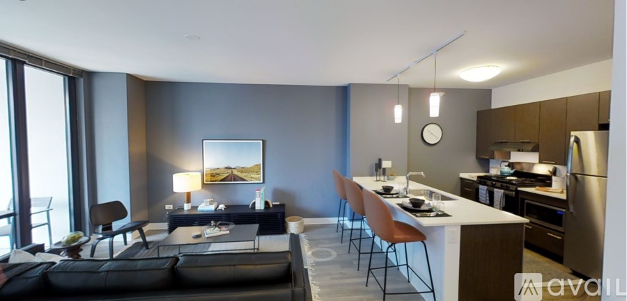 A modern kitchen with a dining table and chairs.