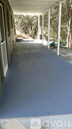 A long covered walkway with columns on either side.