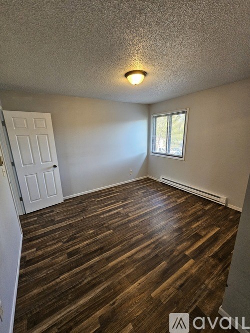 A bathroom with a toilet, sink, and bathtub.