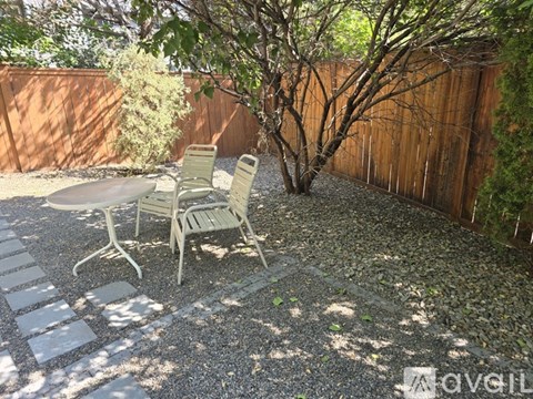 A patio with a table and chairs.