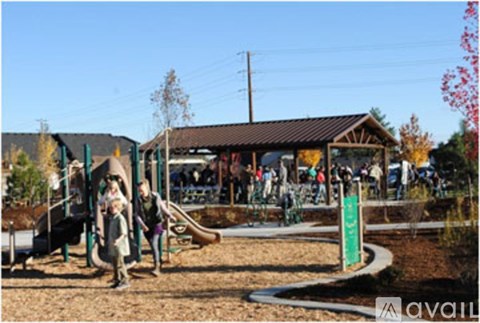 A playground with a swing set and a slide.