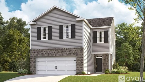 A two-story house with a garage is available for purchase.