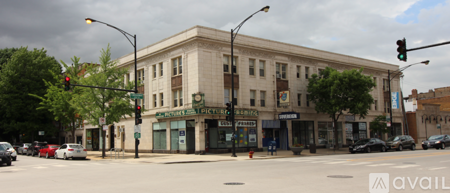 A street view of a building with a green traffic light.