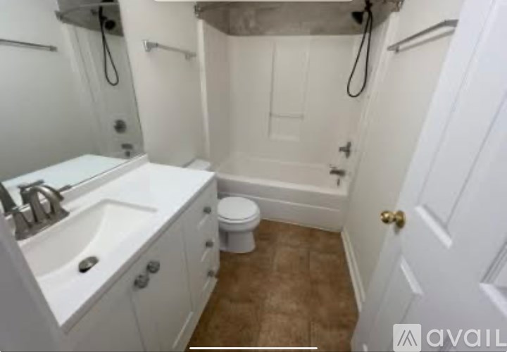 A white bathroom with a toilet and a sink.