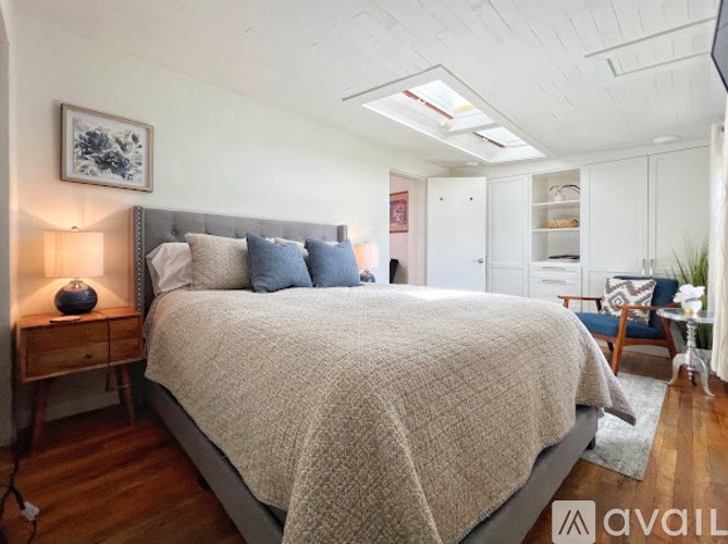 A bathroom with a white vanity and a mirror above it.
