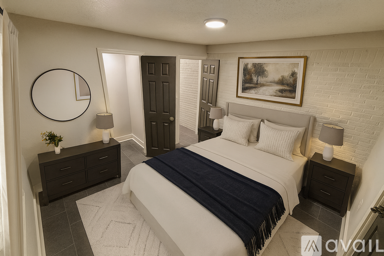A small white closet with a shelf and a black door.