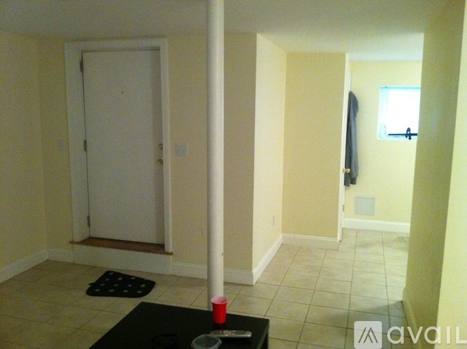 A room with a door and a window.