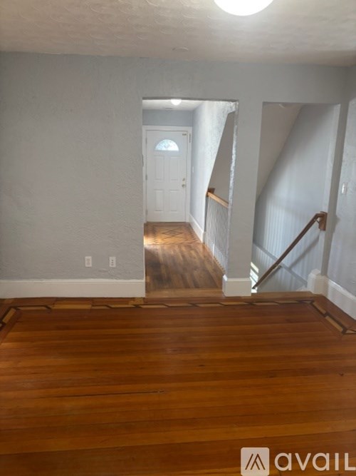 A staircase with wooden balusters and white risers.