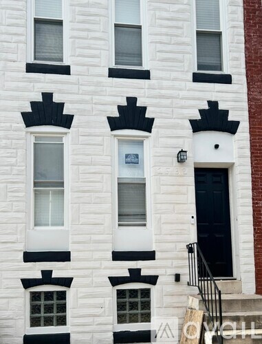 A white building with black trim and windows.