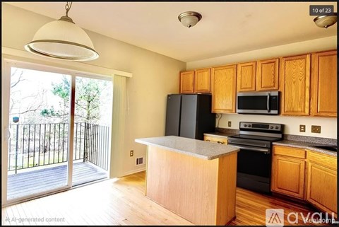 A kitchen with wooden cabinets and black appliances.