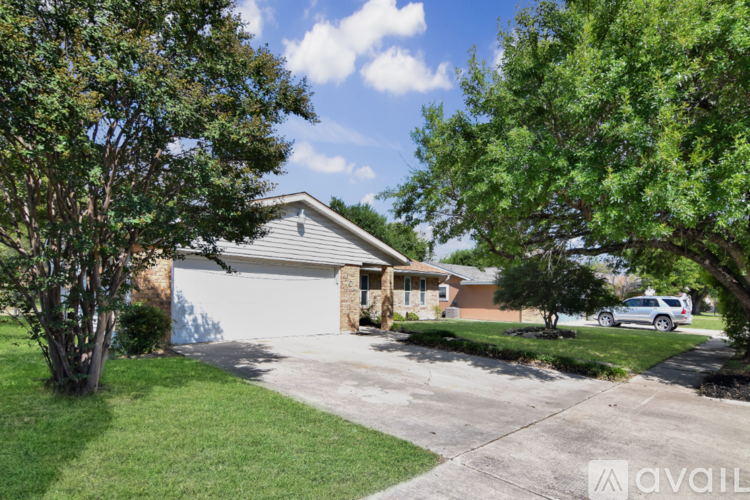 A house with a garage is for sale.