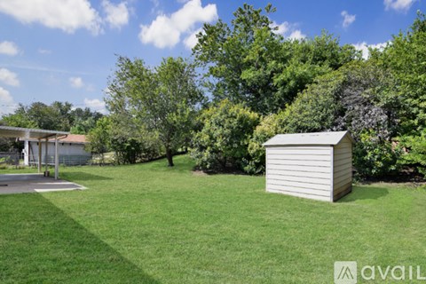 A kitchen with a stainless steel refrigerator and a white oven.