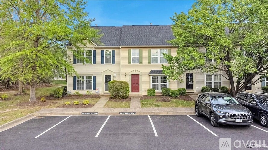 A building with a parking lot in front of it.