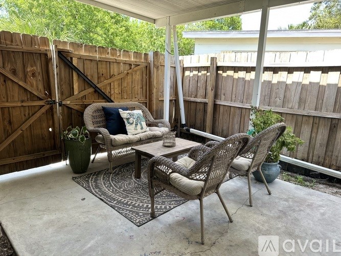 A patio with a table and chairs is available for rent.