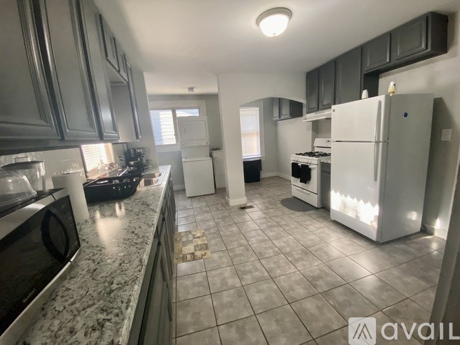 A kitchen with granite countertops and stainless steel appliances.
