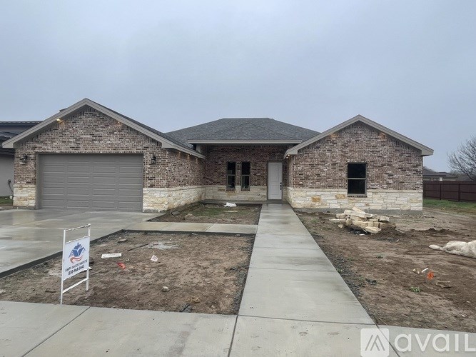 A house with a sign that says "available" in front of it.