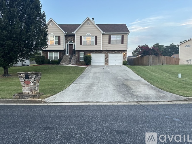 A house with a driveway in front of it.