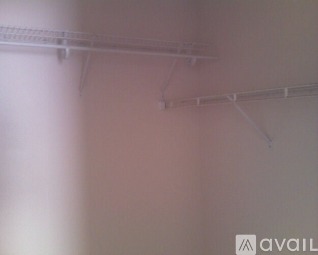 A white shelf is mounted on the wall.