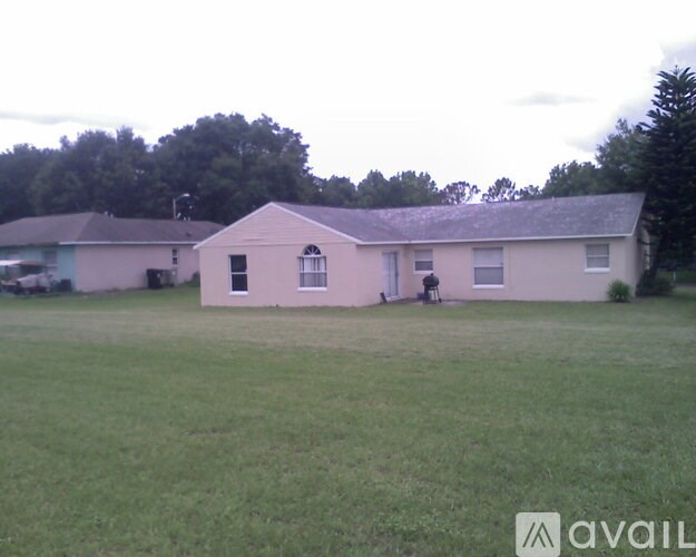 A house with a lawn in front of it.