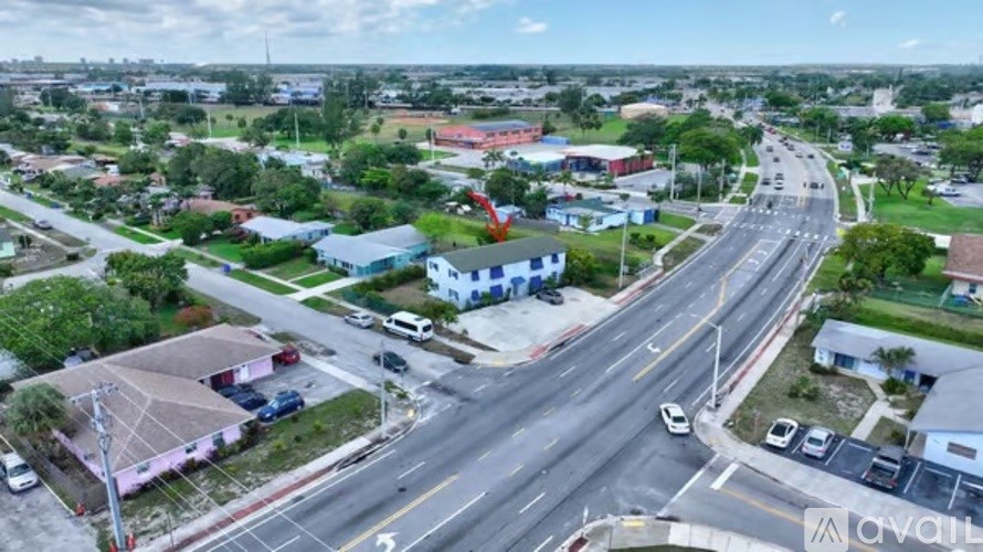 A busy intersection with multiple roads and vehicles.