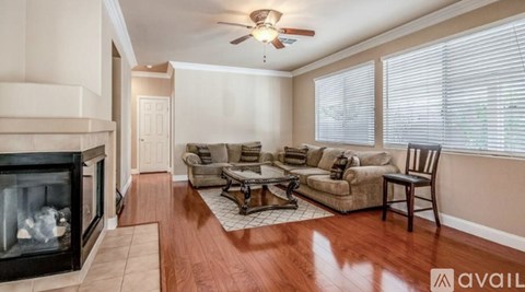 A living room with a fireplace and a couch.