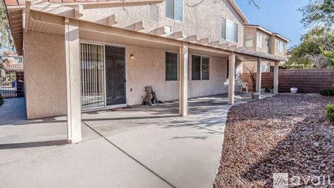 A house with a beige facade and a white door is for sale.