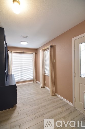 A bathroom with a black granite countertop and white fixtures.