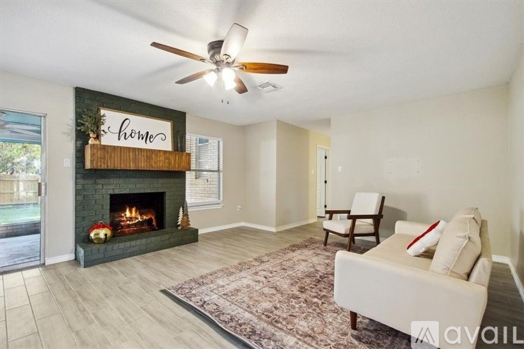 A living room with a fireplace and a couch.