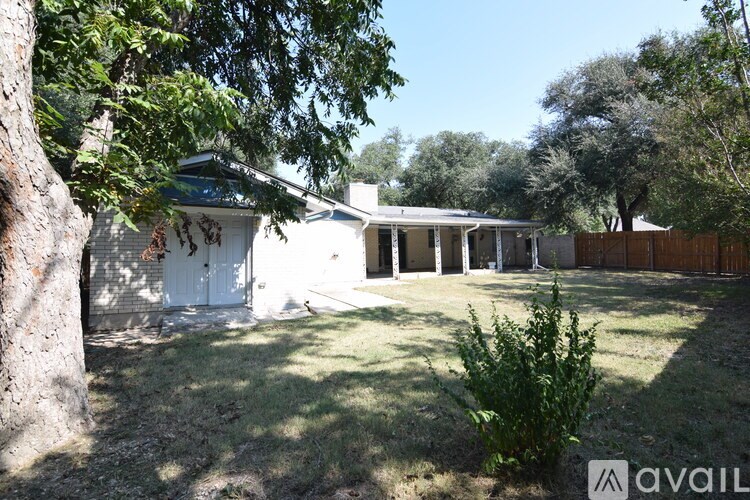 A kitchen with green cabinets and a white counter top.