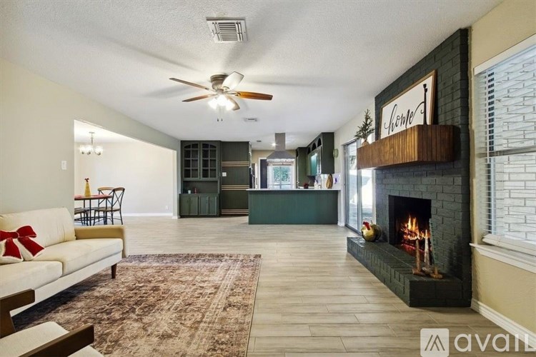 A living room with a fireplace and a couch.