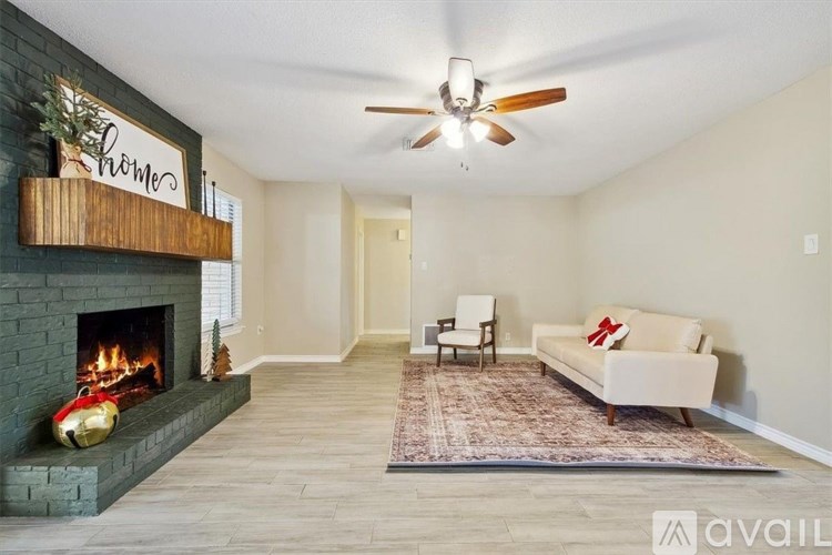 A living room with a fireplace and a couch.