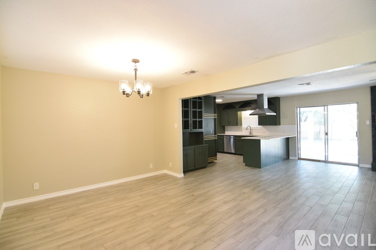 A suburban neighborhood with a mix of houses and trees.