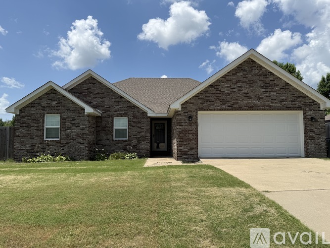 A house with a garage is for sale.