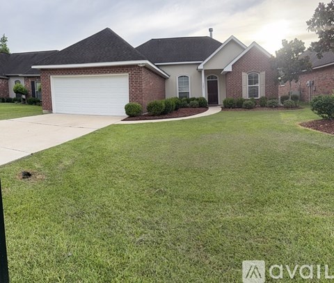 A house with a garage and a driveway.