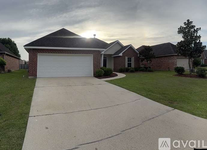 A house with a driveway in front of it.