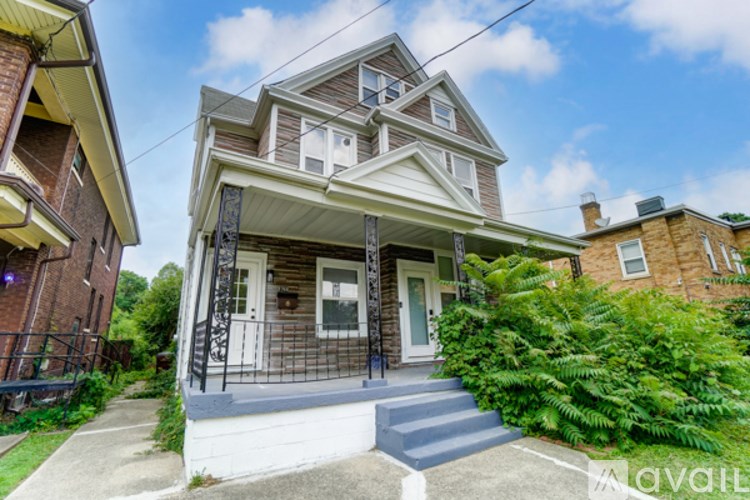 A house with a front porch and a white door.