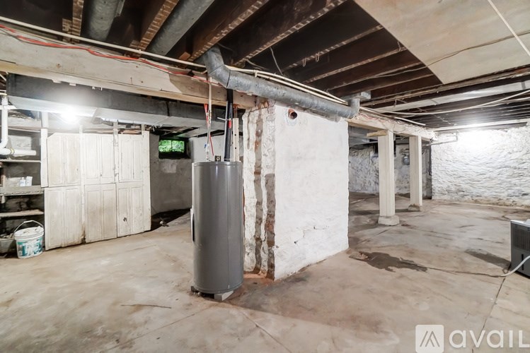 A large industrial room with a water heater and a green digital display.