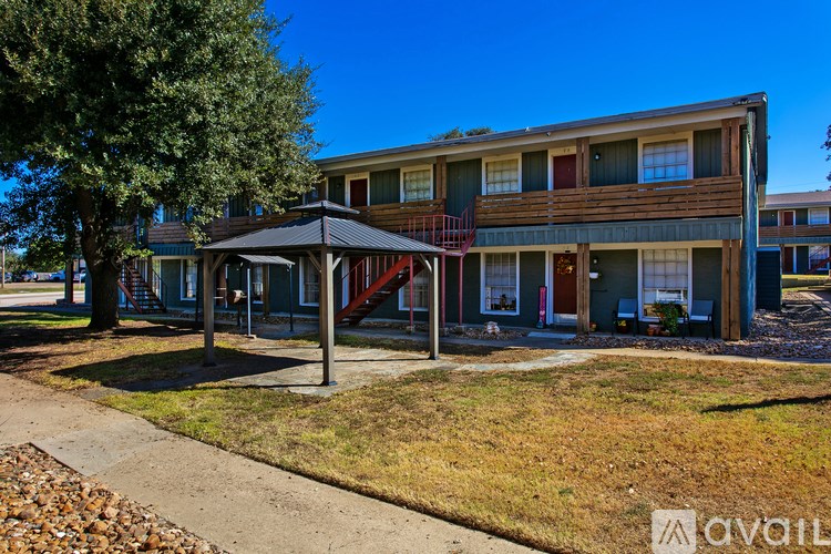 A building with a gazebo in front of it.